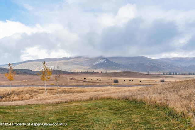 mountain view featuring a rural view