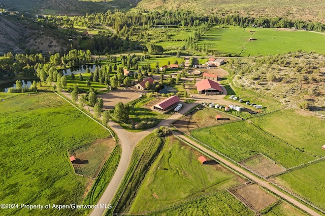 bird's eye view with a rural view and a water view