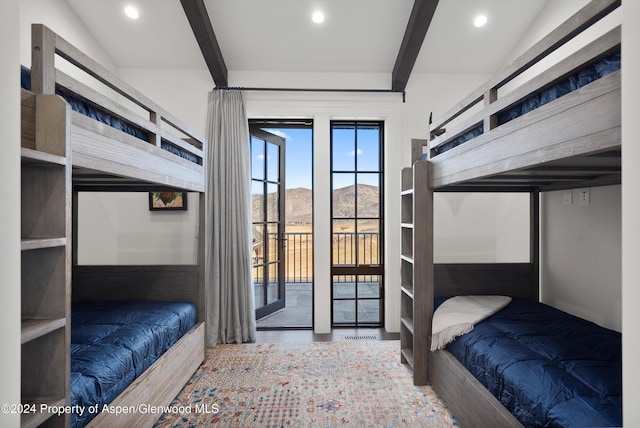 bedroom with access to outside, a mountain view, beamed ceiling, and recessed lighting