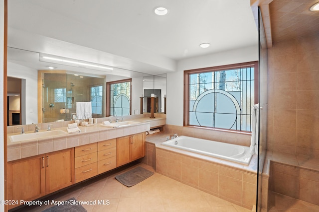 bathroom featuring separate shower and tub, tile patterned floors, and vanity