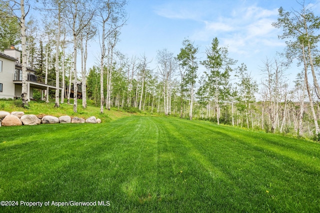 177 Stellar Ln, Snowmass Village, CO 81615 - view of green lawn featuring a wooden deck