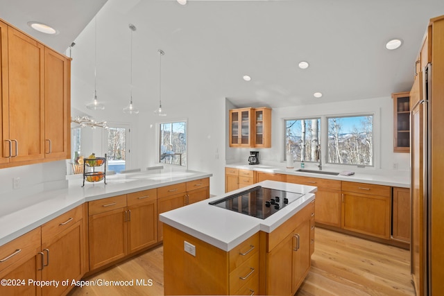 177 Stellar Ln, Snowmass Village, CO 81615 - kitchen with light wood-style flooring, black electric stovetop, glass insert cabinets, light countertops, and recessed lighting