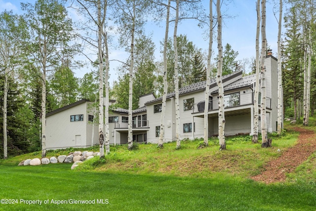 177 Stellar Ln, Snowmass Village, CO 81615 - back of house featuring a chimney and a yard