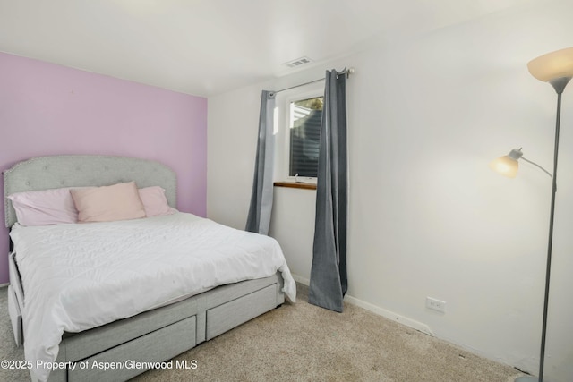 bedroom with light colored carpet