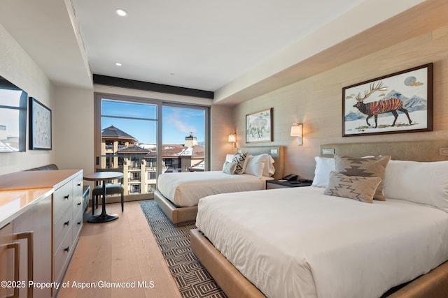 130 Wood Rd Unit 660-662, Snowmass Village, CO 81615 - bedroom with access to exterior, light wood-style floors, and recessed lighting