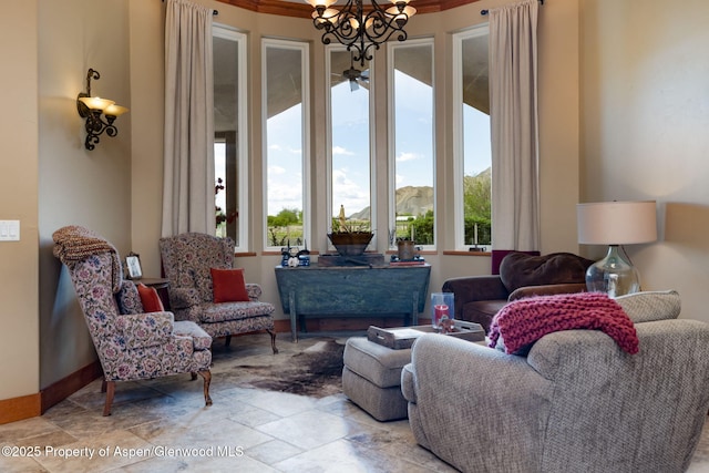 759 36 3/10 Rd, Palisade, CO 81526 - living room featuring a chandelier, stone finish floors, and baseboards