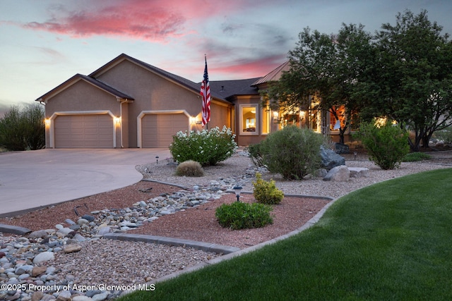 759 36 3/10 Rd, Palisade, CO 81526 - view of front facade with an attached garage, driveway, stucco siding, and a front yard