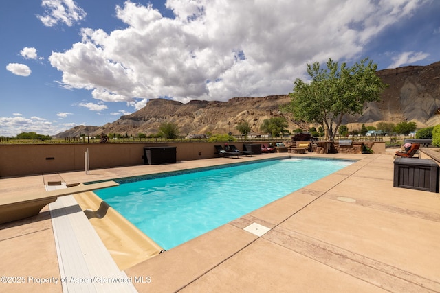 759 36 3/10 Rd, Palisade, CO 81526 - view of swimming pool featuring a mountain view, a patio, and a diving board