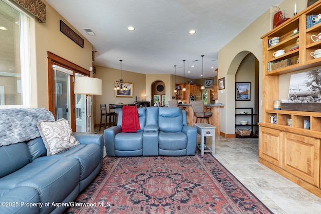 759 36 3/10 Rd, Palisade, CO 81526 - living area featuring recessed lighting, arched walkways, a chandelier, plenty of natural light, and baseboards