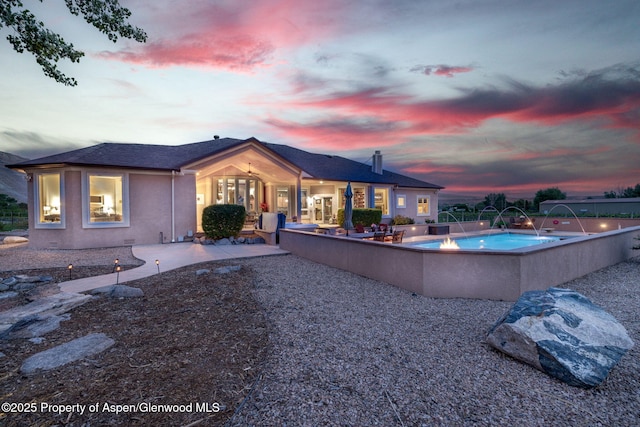 759 36 3/10 Rd, Palisade, CO 81526 - back of house with a patio area, an outdoor pool, and stucco siding