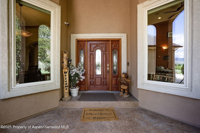 759 36 3/10 Rd, Palisade, CO 81526 - property entrance with stucco siding