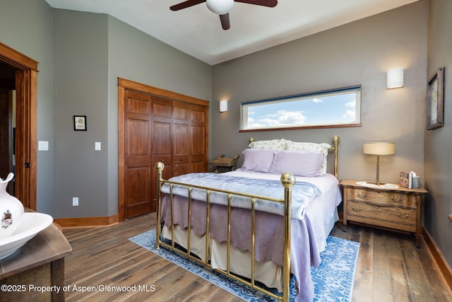 759 36 3/10 Rd, Palisade, CO 81526 - bedroom featuring wood finished floors, baseboards, a closet, and a ceiling fan