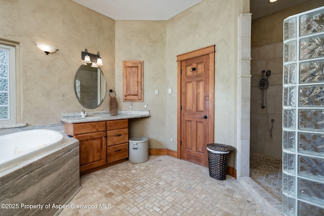 759 36 3/10 Rd, Palisade, CO 81526 - bathroom with walk in shower, a bath, and vanity