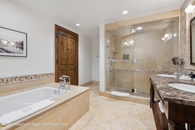 bathroom featuring tile patterned floors, vanity, and independent shower and bath