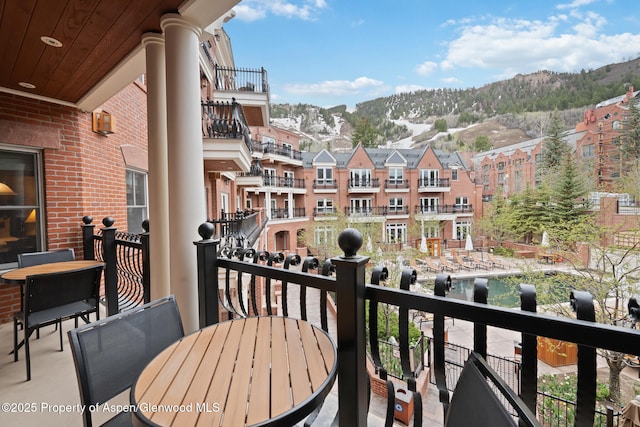 balcony featuring a mountain view