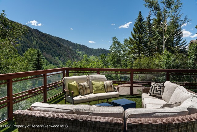 wooden terrace featuring a mountain view