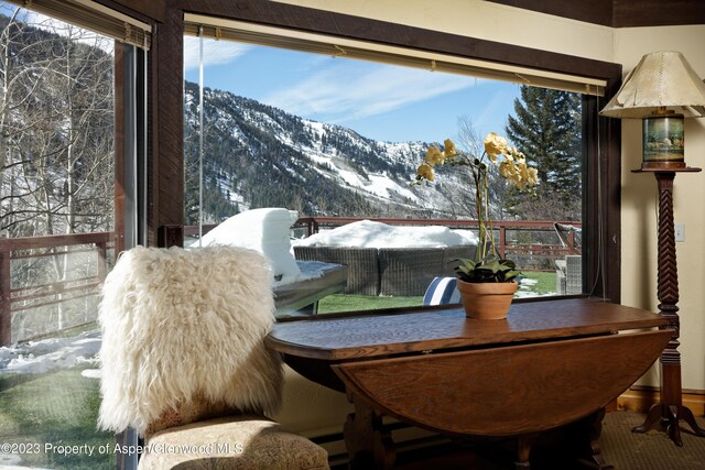 dining room featuring a mountain view