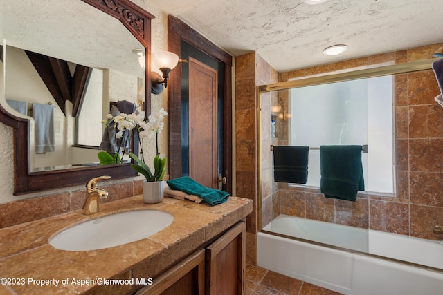 0184 Mountain Laurel Dr, Aspen, CO 81611 - bathroom with plenty of natural light, shower / bath combination with glass door, and vanity