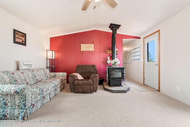 400 Behrman St, Craig, CO 81625 - living area featuring a wood stove, carpet floors, and a ceiling fan
