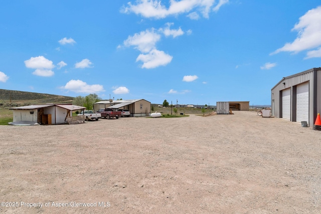 400 Behrman St, Craig, CO 81625 - view of yard with an outbuilding and a garage