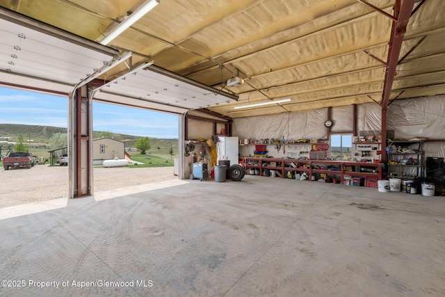 400 Behrman St, Craig, CO 81625 - garage featuring a workshop area and a garage door opener