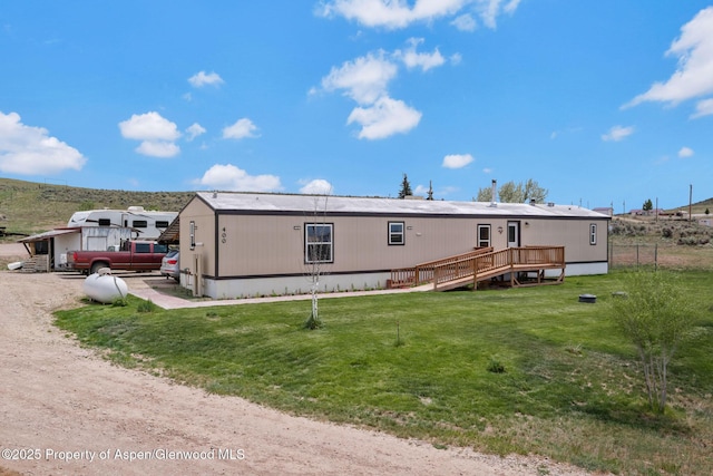 400 Behrman St, Craig, CO 81625 - view of front of property with a front lawn and a wooden deck