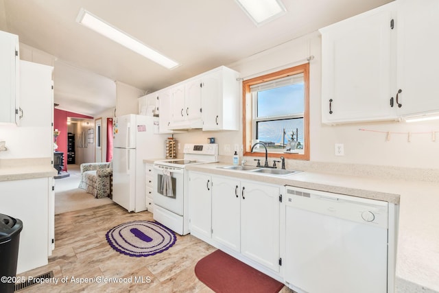 400 Behrman St, Craig, CO 81625 - kitchen with white appliances, a sink, white cabinetry, lofted ceiling, and light countertops