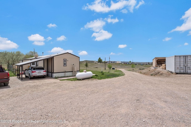 400 Behrman St, Craig, CO 81625 - exterior space featuring driveway and a carport