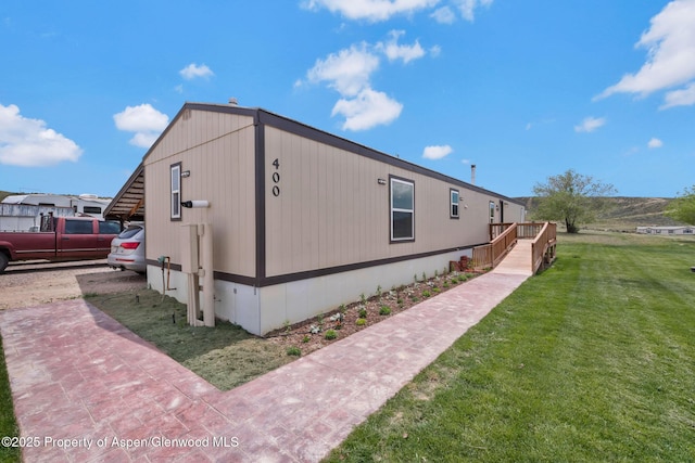 400 Behrman St, Craig, CO 81625 - view of home's exterior with a lawn