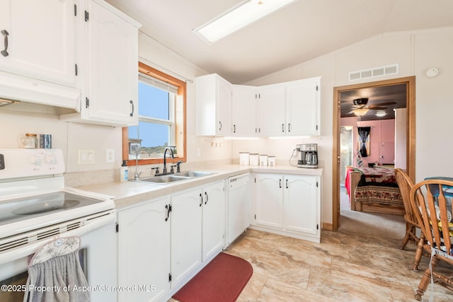 400 Behrman St, Craig, CO 81625 - kitchen featuring white appliances, a sink, lofted ceiling, white cabinets, and light countertops