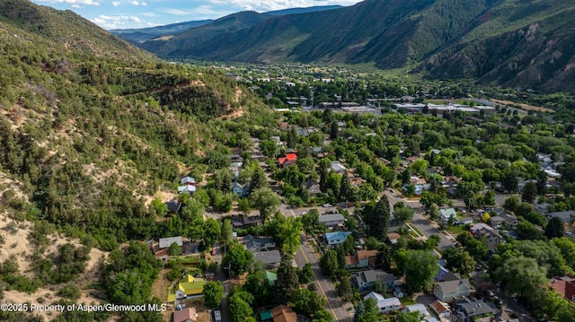 1026 Palmer Ave, Glenwood Springs, CO 81601 - aerial view of property and surrounding area with a mountain backdrop and nearby suburban area