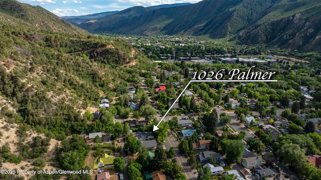 1026 Palmer Ave, Glenwood Springs, CO 81601 - aerial overview of property's location featuring mountains, property boundaries highlighted, and nearby suburban area