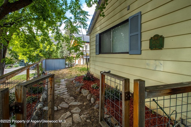 1026 Palmer Ave, Glenwood Springs, CO 81601 - view of property exterior featuring a storage shed and a gate