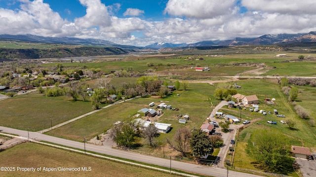 drone / aerial view with a mountain view and a rural view