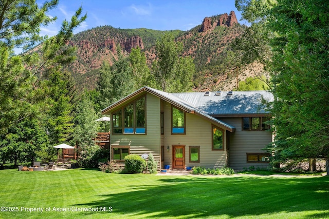 2755 Lower River Rd, Snowmass, CO 81654 - rear view of property with a yard and a mountain view