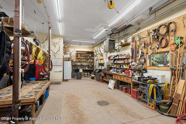 2755 Lower River Rd, Snowmass, CO 81654 - garage with a workshop area and freestanding refrigerator