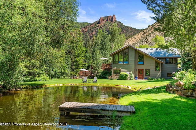 2755 Lower River Rd, Snowmass, CO 81654 - back of house featuring a yard and a water and mountain view
