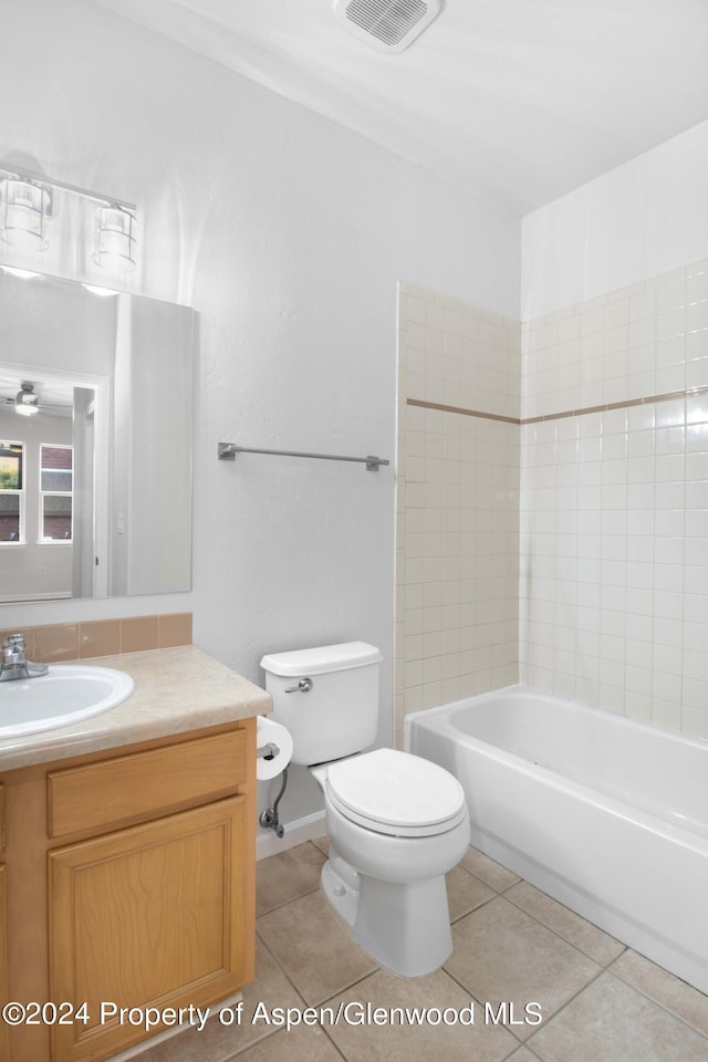 full bathroom featuring tile patterned floors, vanity, ceiling fan, shower / tub combination, and toilet