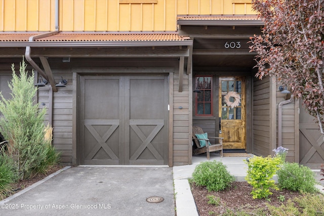 doorway to property with board and batten siding