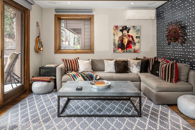 610 S W End St Unit K102, Aspen, CO 81611 - living room featuring a wall mounted air conditioner, wood finished floors, and recessed lighting