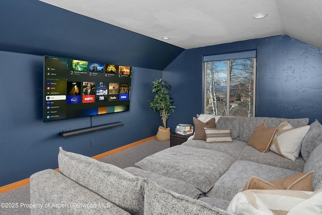 cinema with carpet, baseboards, and lofted ceiling