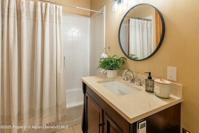 bathroom featuring shower / bath combo and vanity