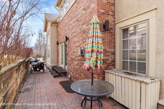 view of patio / terrace with radiator heating unit and grilling area