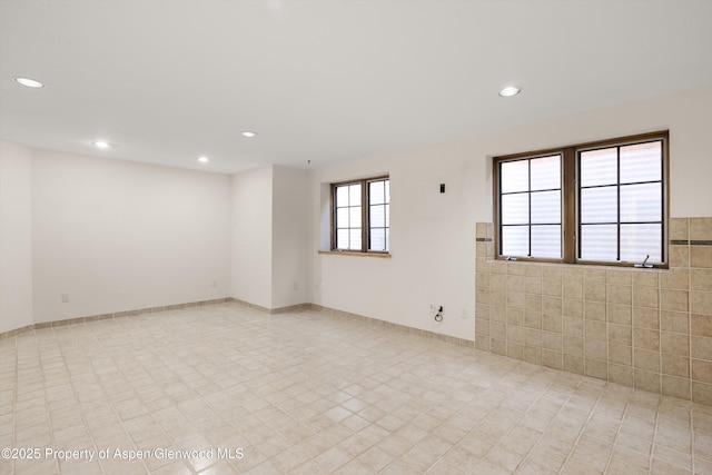 empty room with recessed lighting