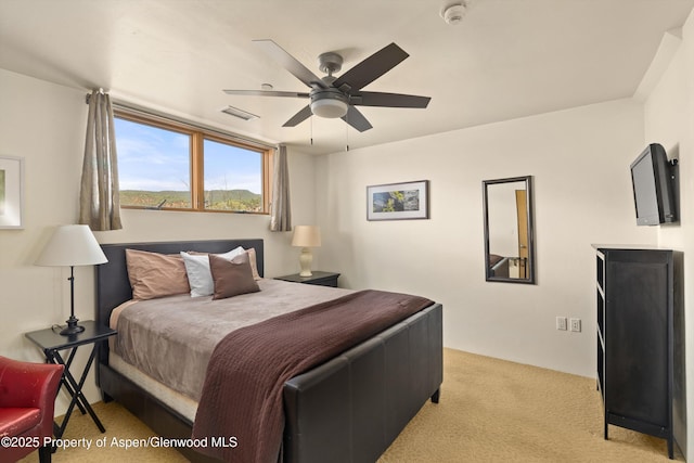 2633 Dolores Way, Carbondale, CO 81623 - bedroom with ceiling fan, light carpet, and visible vents