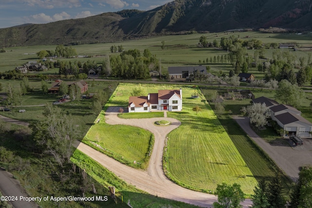 bird's eye view featuring a rural view and a mountain view