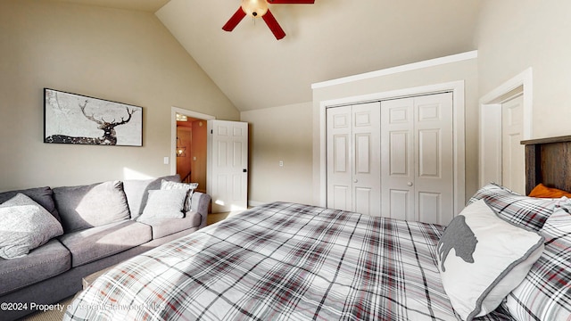 bedroom featuring a ceiling fan, a closet, and high vaulted ceiling