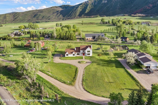 drone / aerial view with a mountain view and a rural view