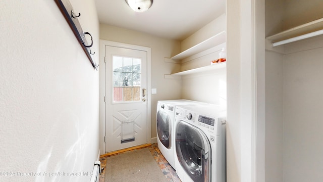 laundry room with laundry area and washing machine and clothes dryer