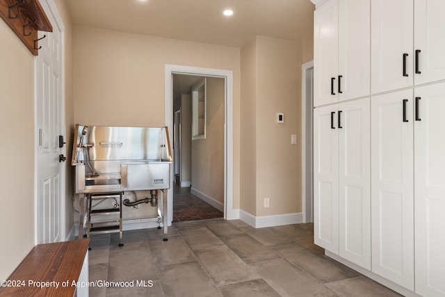 office with recessed lighting and baseboards